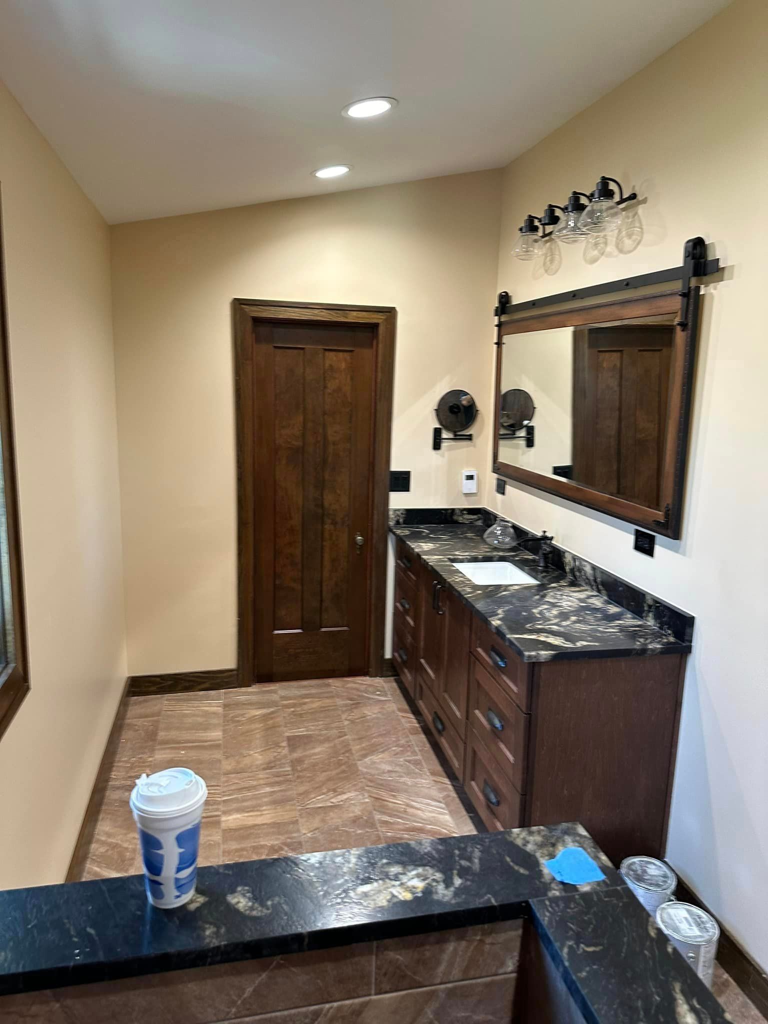 a bathroom with two sinks and a mirror .