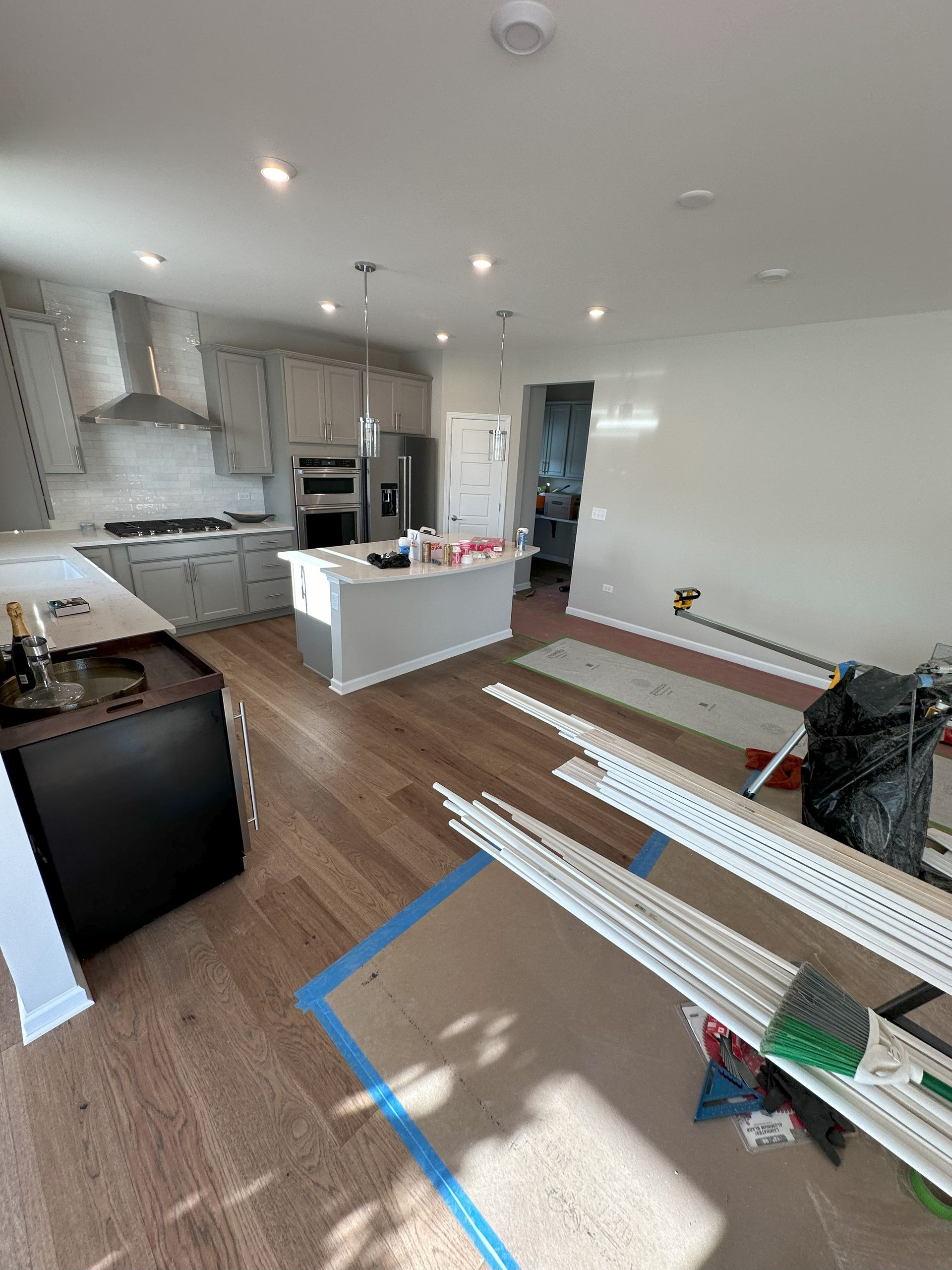 a kitchen and living room are being remodeled in a house .