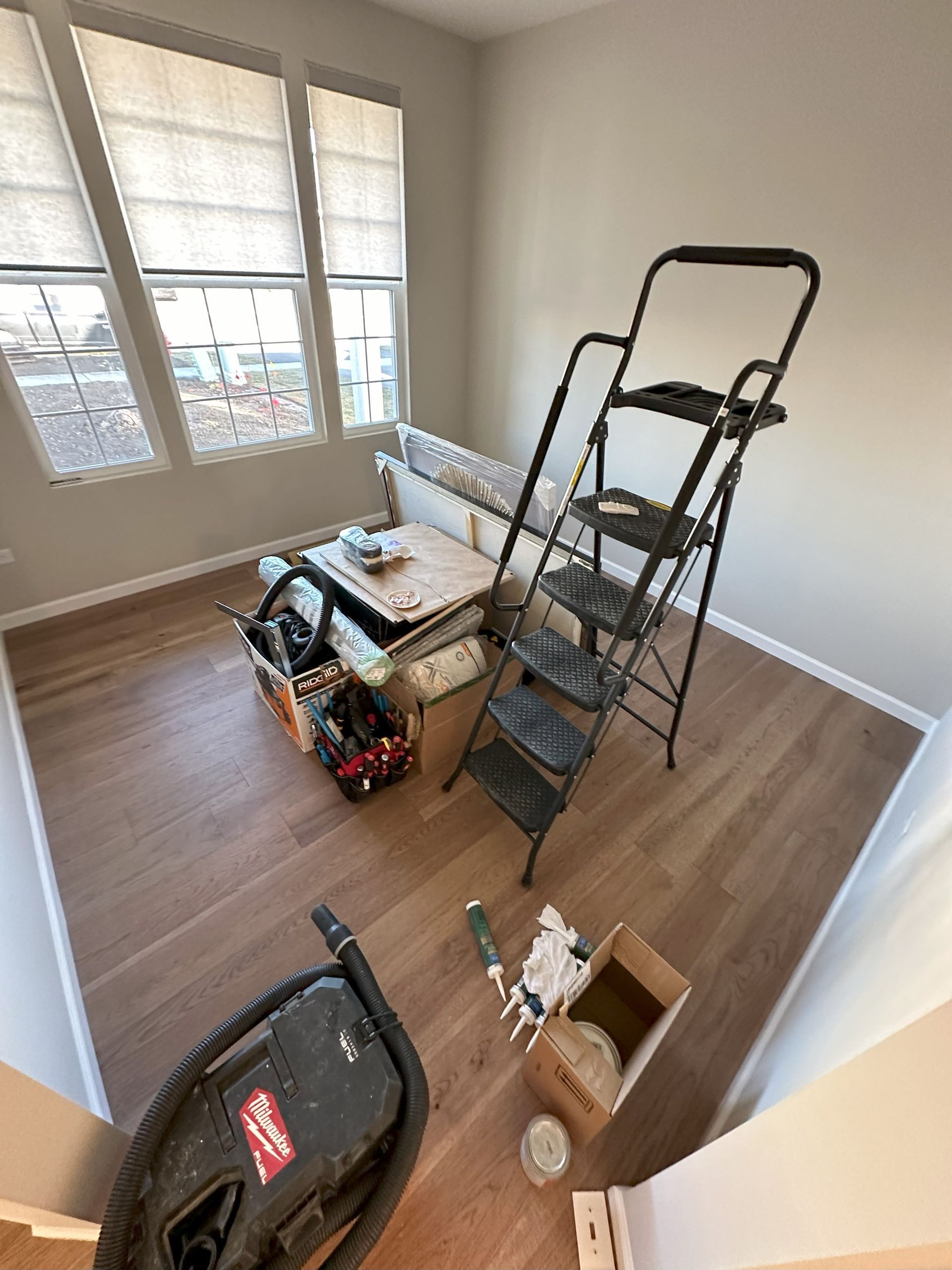 there is a ladder in the middle of the room .