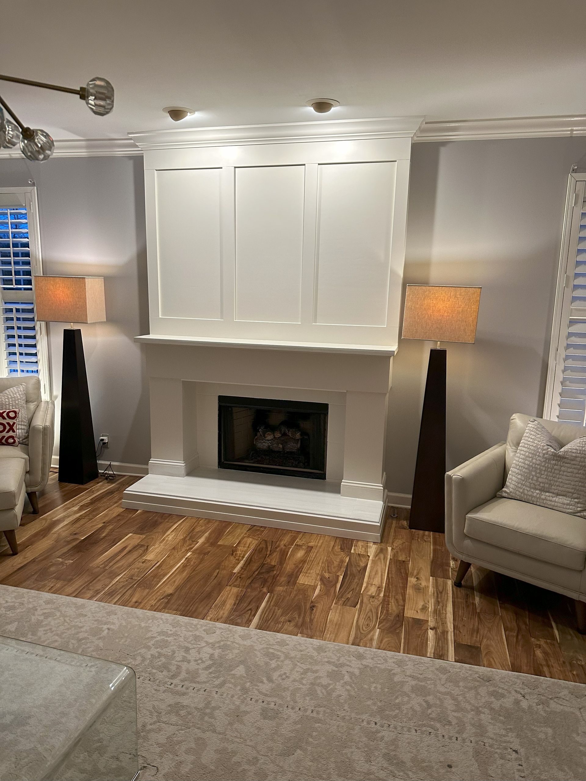 there is a fireplace in the middle of the living room .