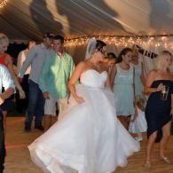 bride and wedding guests dancing