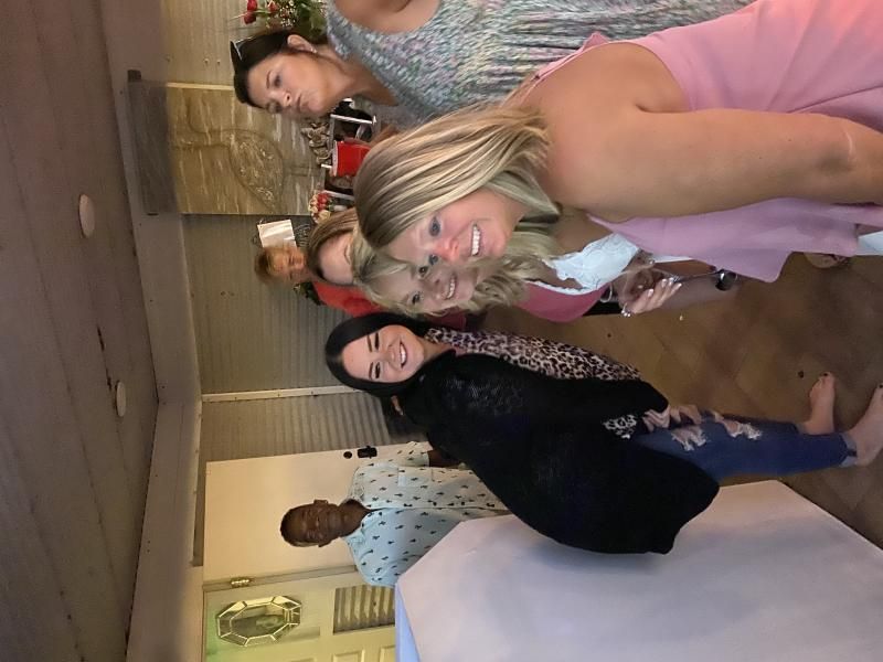 women smiling for photo booth picture