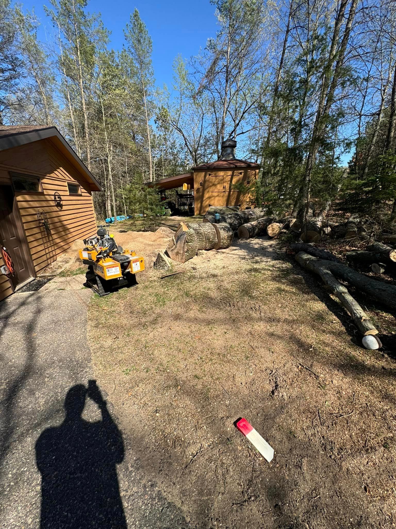 A man is taking a picture of an atv parked in front of a house.