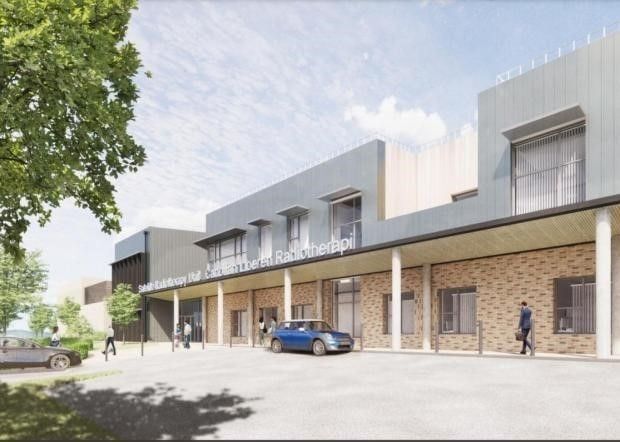 Exterior rendering of a modern brick building with a covered entrance, a car, and people walking.