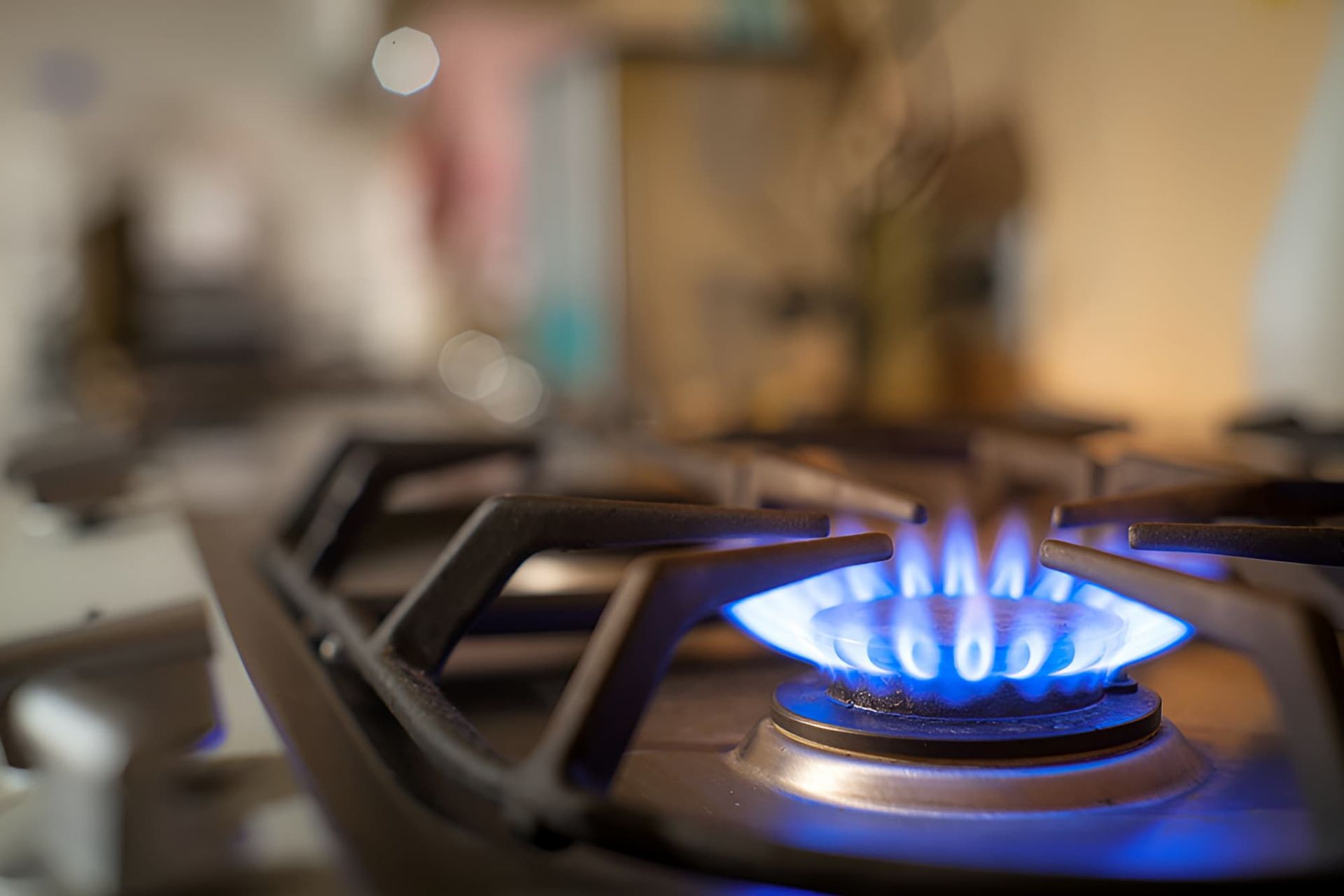A Close Up Of A Gas Stove With A Blue Flame — GPS Plumbing, Drainage & Gasfitting In Dubbo, NSW