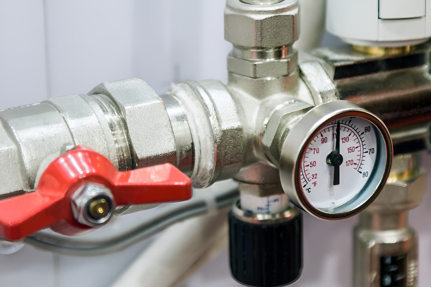 A Valve And A Pressure Gauge On A Pipe — GPS Plumbing, Drainage & Gasfitting In Dubbo, NSW