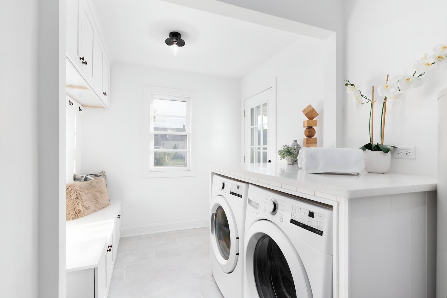 A Laundry Room With Two Washers And Two Dryers — GPS Plumbing, Drainage & Gasfitting In Dubbo, NSW