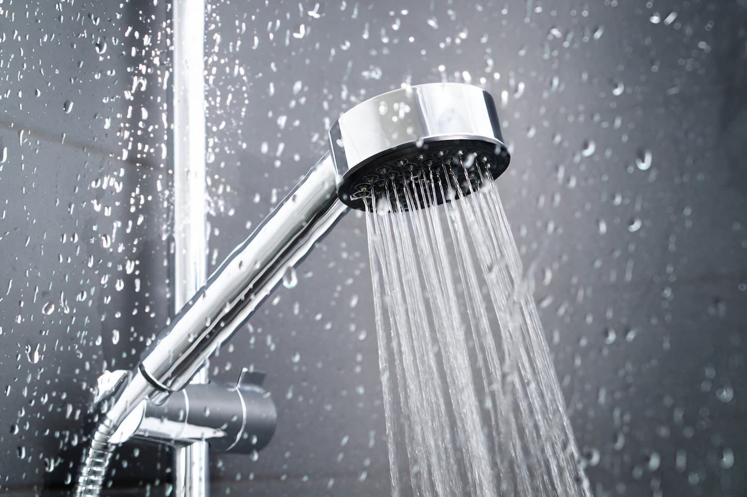 A Close Up Of A Shower Head With Water Coming Out Of It — GPS Plumbing, Drainage & Gasfitting In Dubbo, NSW