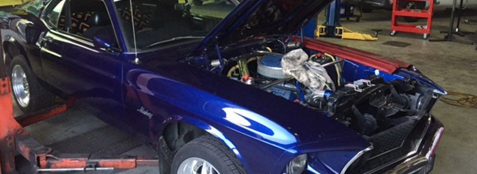 aussie  rake and clutch blue car with open hood