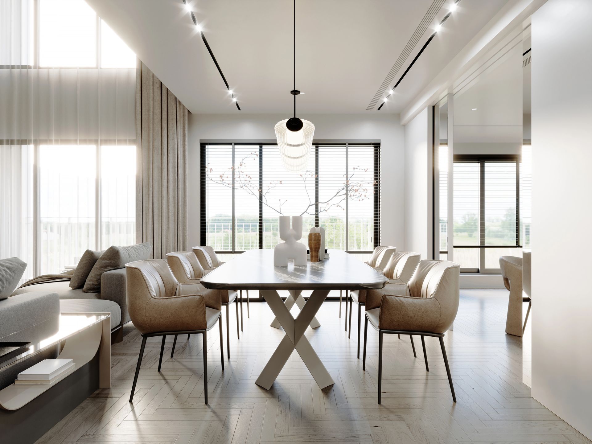 Cucina e soggiorno moderni con mobili bianchi, piano di lavoro nero, divano con cuscini rossi.