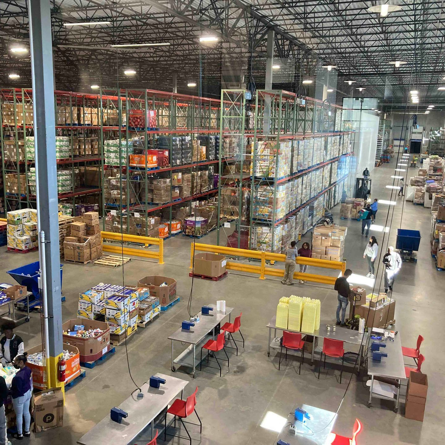 An aerial view of a large warehouse filled with lots of boxes.