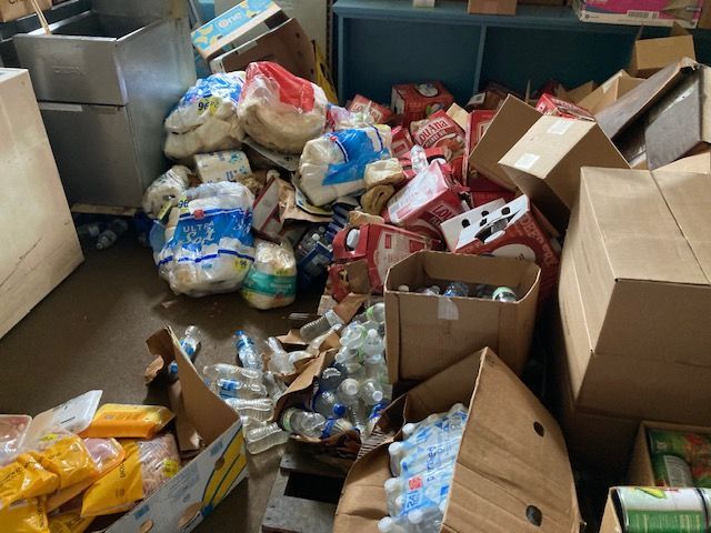 A room filled with lots of boxes and bags of food