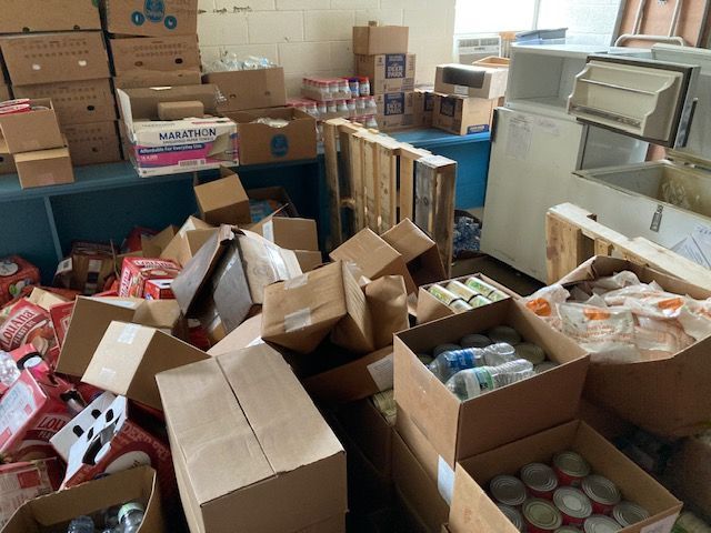 A room filled with lots of boxes and cans of food.