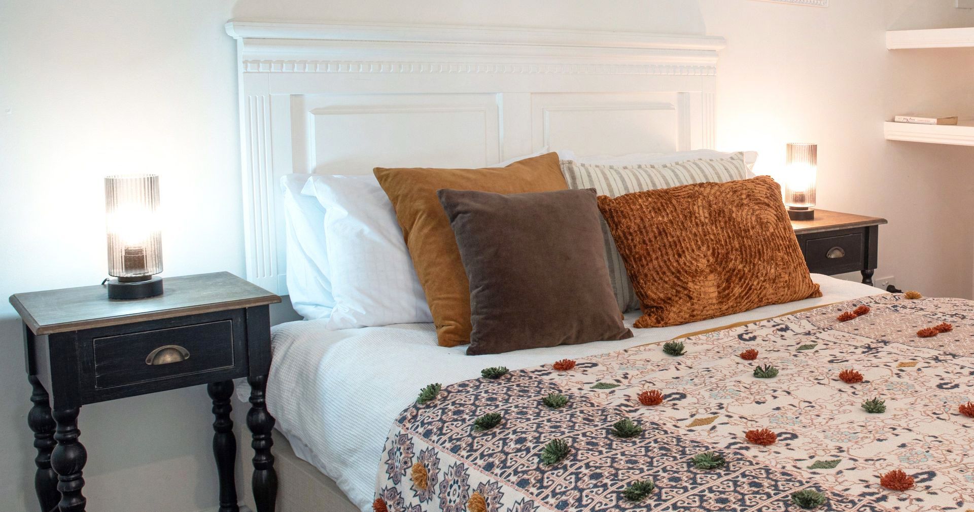 A Bedroom With a Bed Two Nightstands and a Lamp — Gold Coast Detox and Rehab Services in Gold Coast, QLD