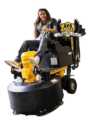 A person sits on a yellow and black industrial floor grinder, talking on a phone, in front of an XPS Xpress logo.