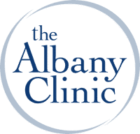the albany clinic logo is blue and white in a circle .