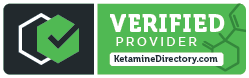 a green and black verified provider badge with a check mark on it .