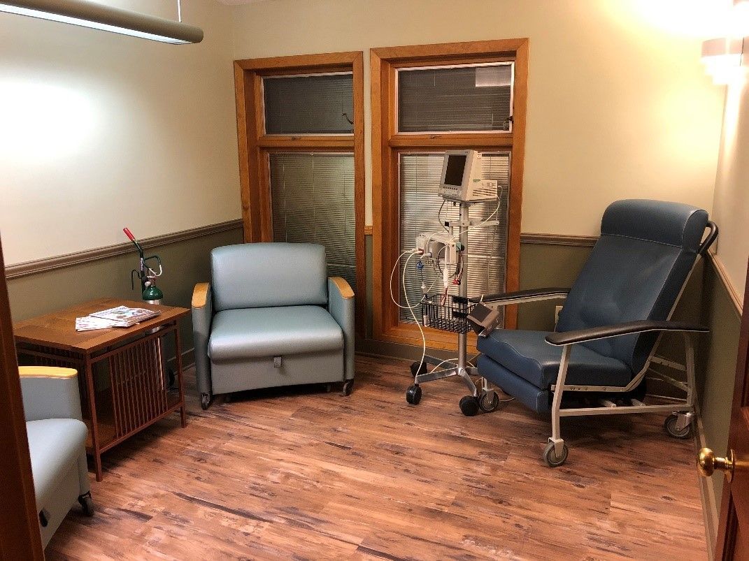 A room with two chairs and a recliner in it - the albany clinic in carbondale Illinois