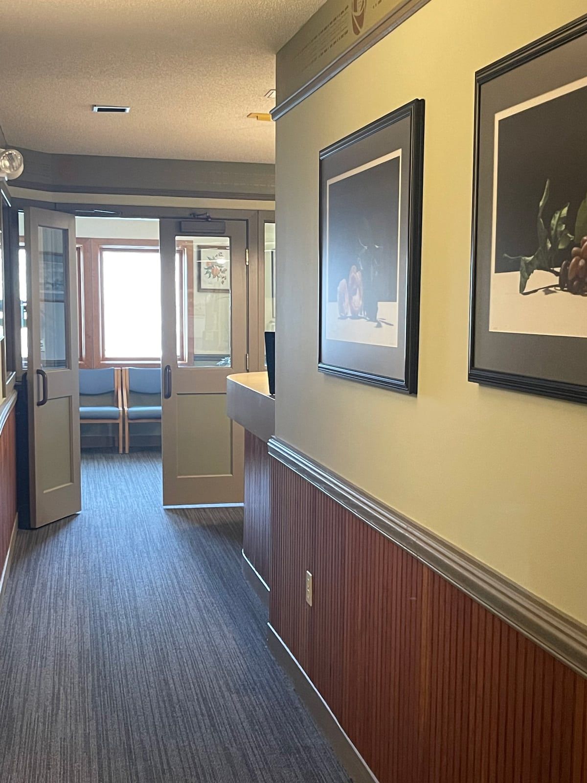 A hallway in a building with pictures on the wall - the albany clinic in carbondale Illinois