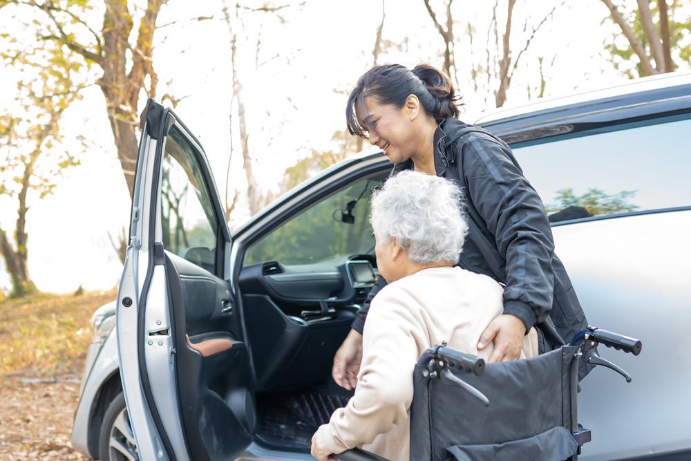 Elderly Woman Getting Assistance to Move Into Car — Active Lifestyle Supports In Shellharbour, NSW