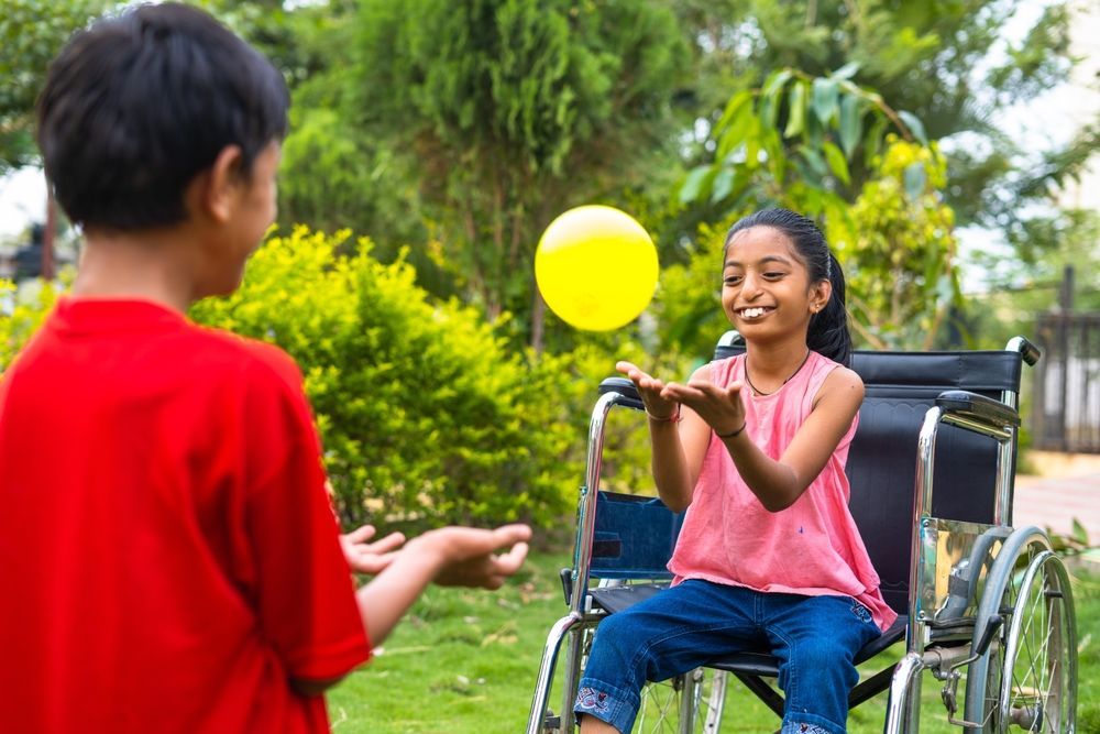 Children Playing With a Yellow Ball — Active Lifestyle Supports In Shellharbour, NSW