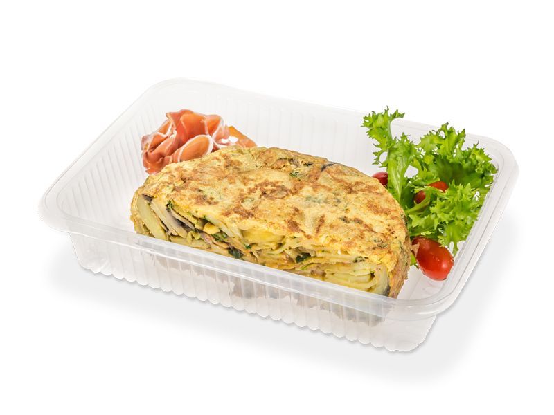 Bandeja para alimentos de plástico transparente y rectangular con lados estriados y patrón en zigzag en la parte inferior.