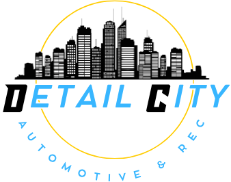 Detail City logo with black skyline, blue and black text, and &ldquo;Automotive & Rec&rdquo; in a yellow circle