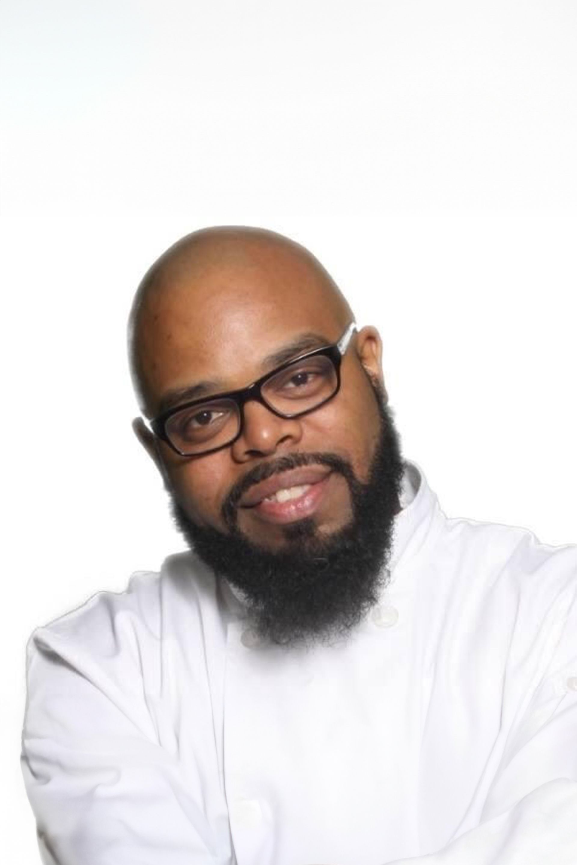 Silhouette of a person with curly hair, glasses, and a collared shirt, facing to the side.