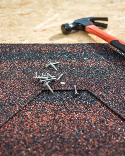 Roofing Services — Shingles And Hammer And Nails in Tampa, FL