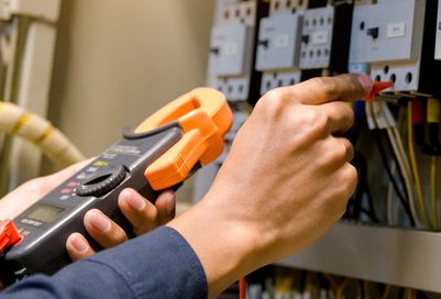 Electrician engineer work tester measuring voltage