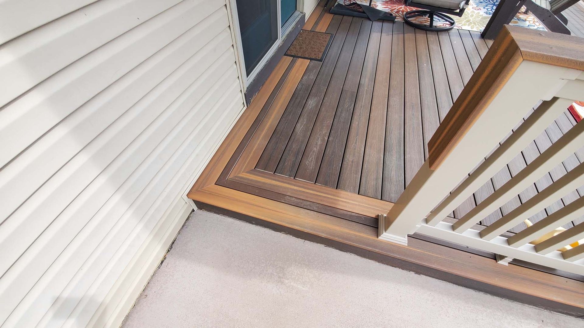 A wooden deck with stairs leading up to it