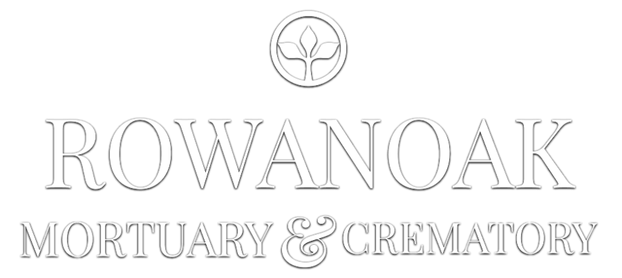 Rowanoak Mortuary & Crematory logo with a black and white stylized leaf design in a pentagon shape.