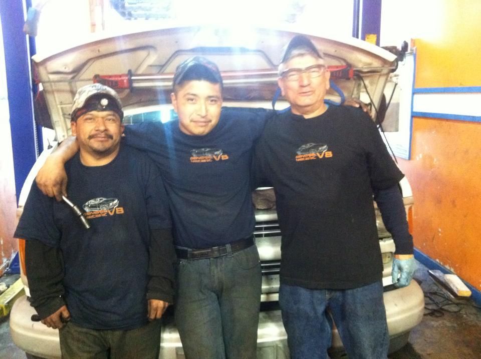 Father in the middle, two employees at his side.