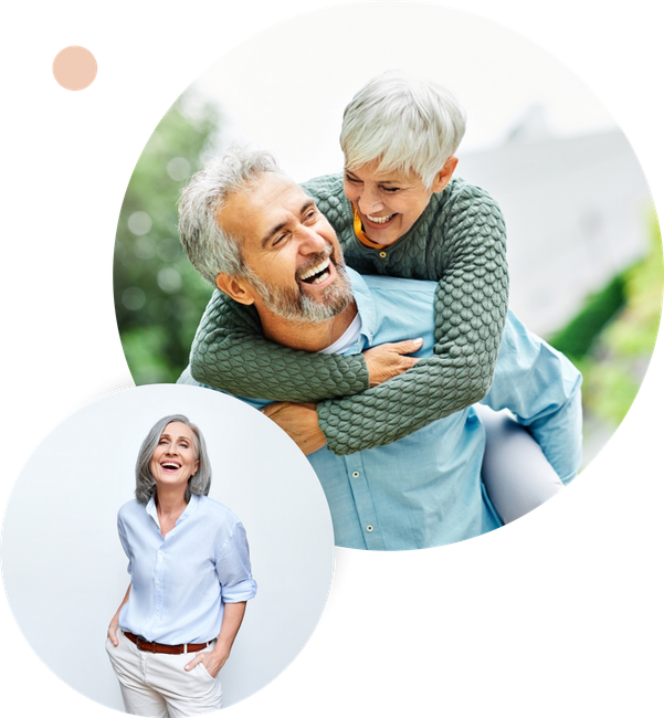 a man and a woman are smiling in front of a brick building