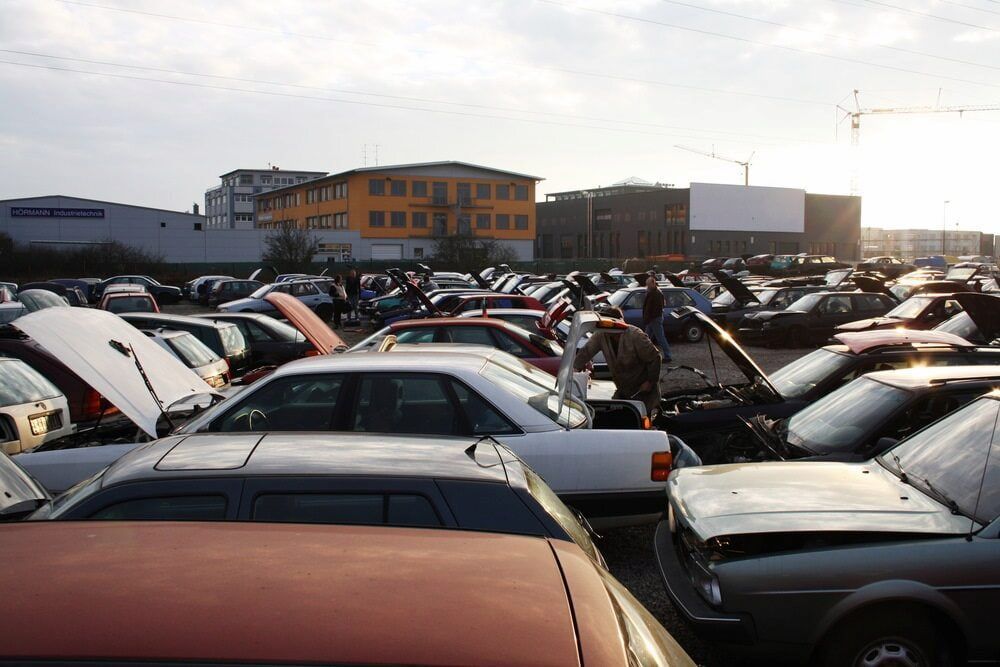 Cars Parked Closely Together in a Junkyard; Several Hoods Are Open — Central Scrap Metal in Willawong, QLD
