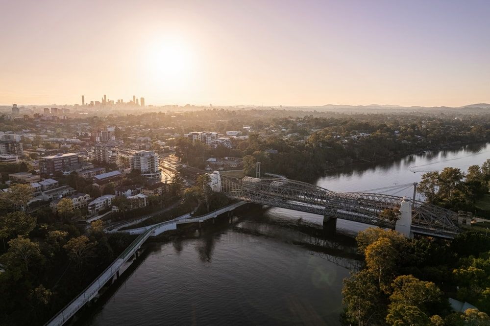 Aerial View of Brisbane River With Bridge and City Skyline at Sunset — Central Scrap Metal in Indooroopilly, QLD