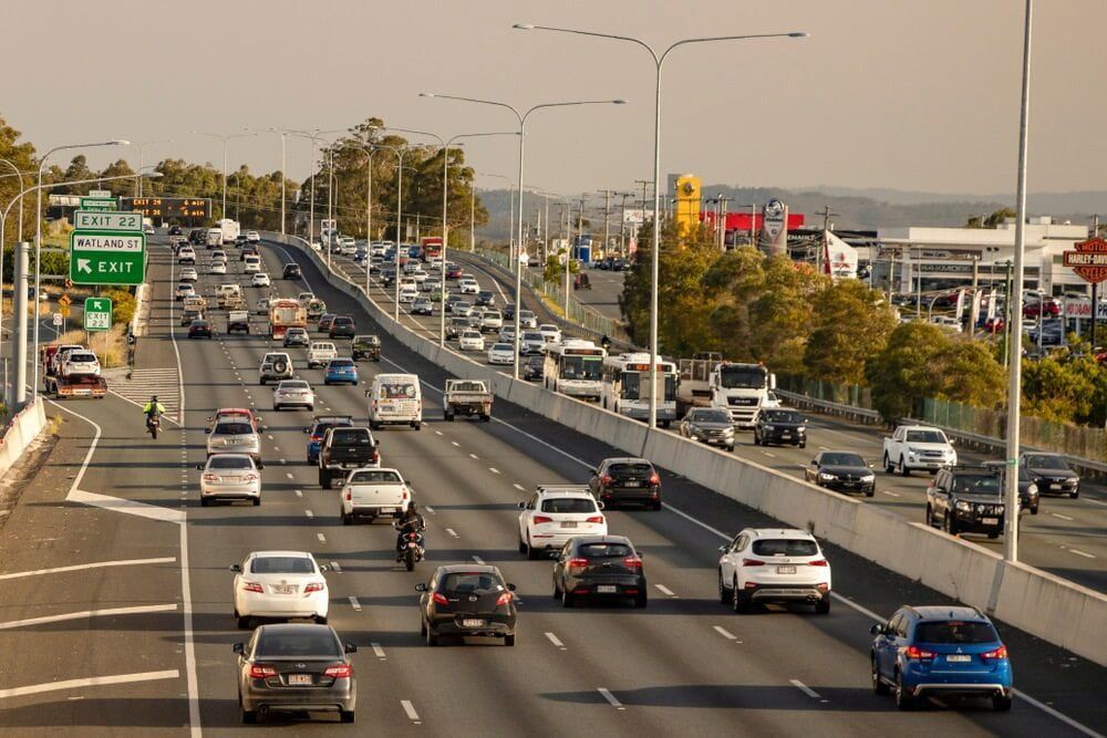 Busy Highway Scene With Many Cars, Trucks, and a Motorcycle Driving — Central Scrap Metal in Logan, QLD