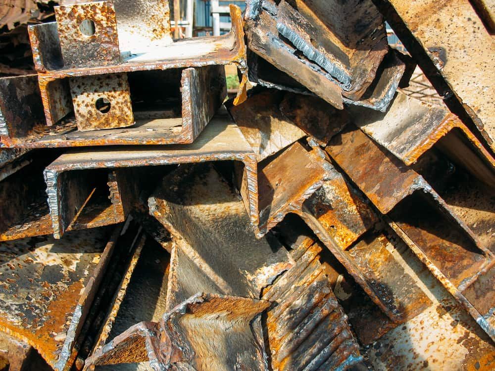 Pile of Rusty Steel Beams and Angles, Likely Scrap Metal, Outdoors — Central Scrap Metal in Willawong, QLD