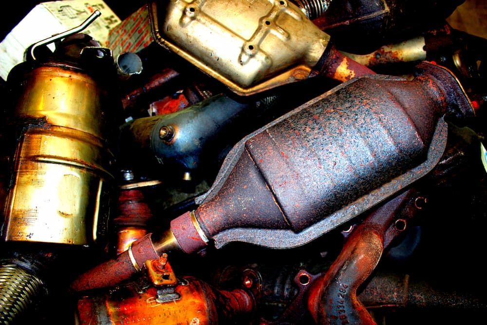 Pile of Rusty Catalytic Converters in Varying Shapes and Sizes — Central Scrap Metal in Willawong, QLD