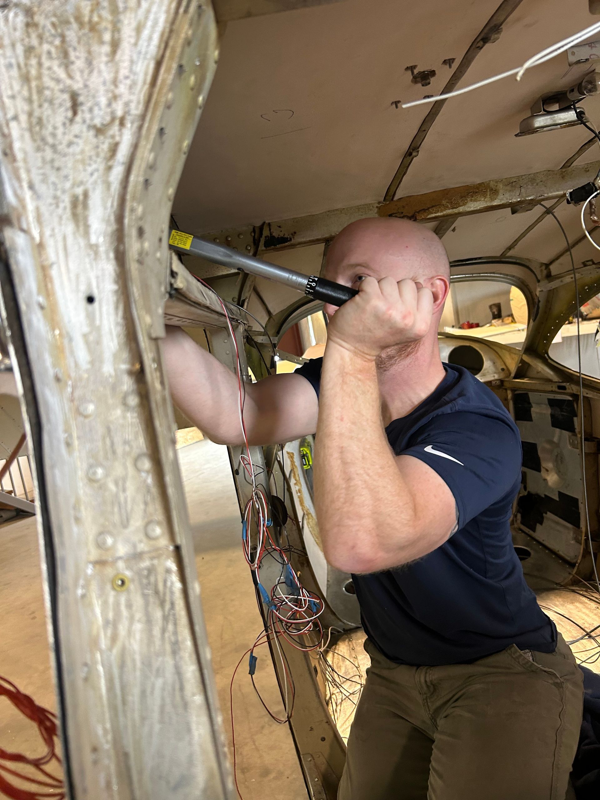 A man is working on an airplane