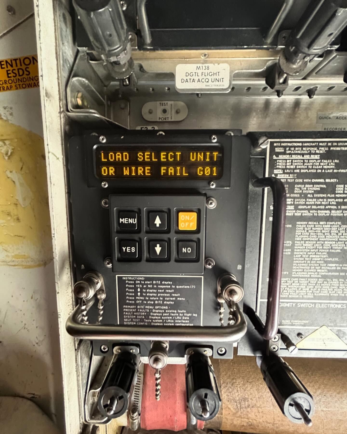 A sign that says load select unit on it