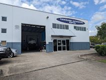 A Large Building With A Sign That Says Currimundi Automotive Service — Currimundi Automotive Service In Warana, QLD