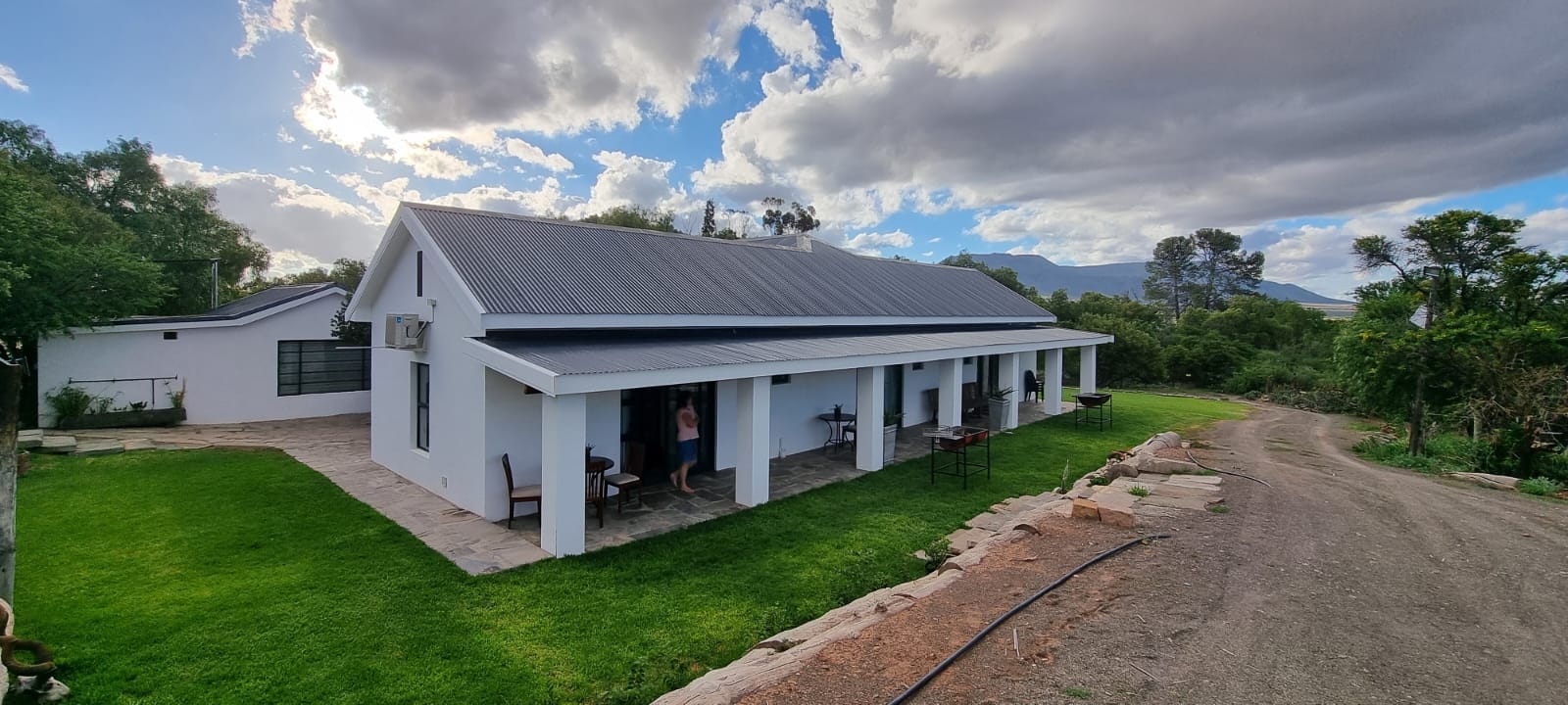 The Accommodation at Baakensrug. A spectacular home sitting on top of a lush green field.