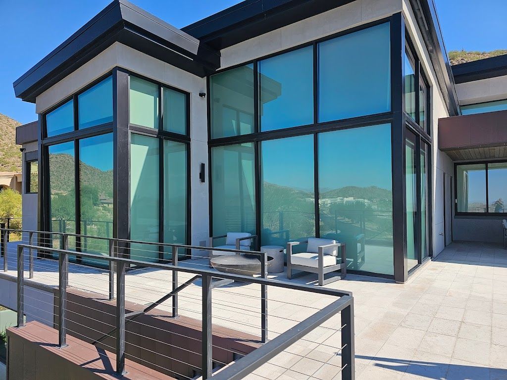 A large house with a lot of windows and a balcony.