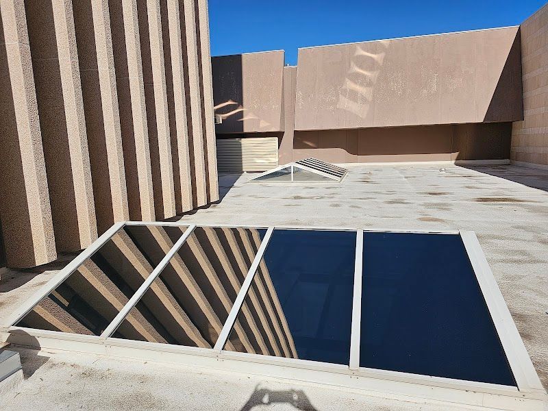 A building with a reflection of a building in the window