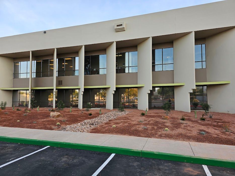 A large building with a parking lot in front of it