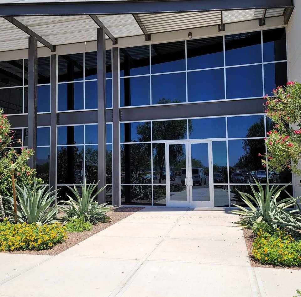A large building with lots of windows and a door
