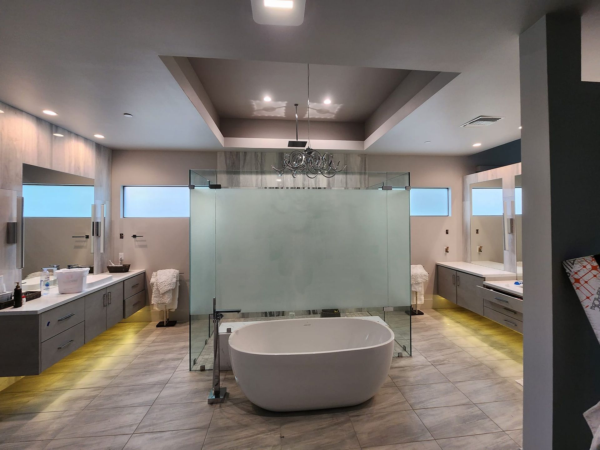 A large bathroom with a bathtub and a walk in shower