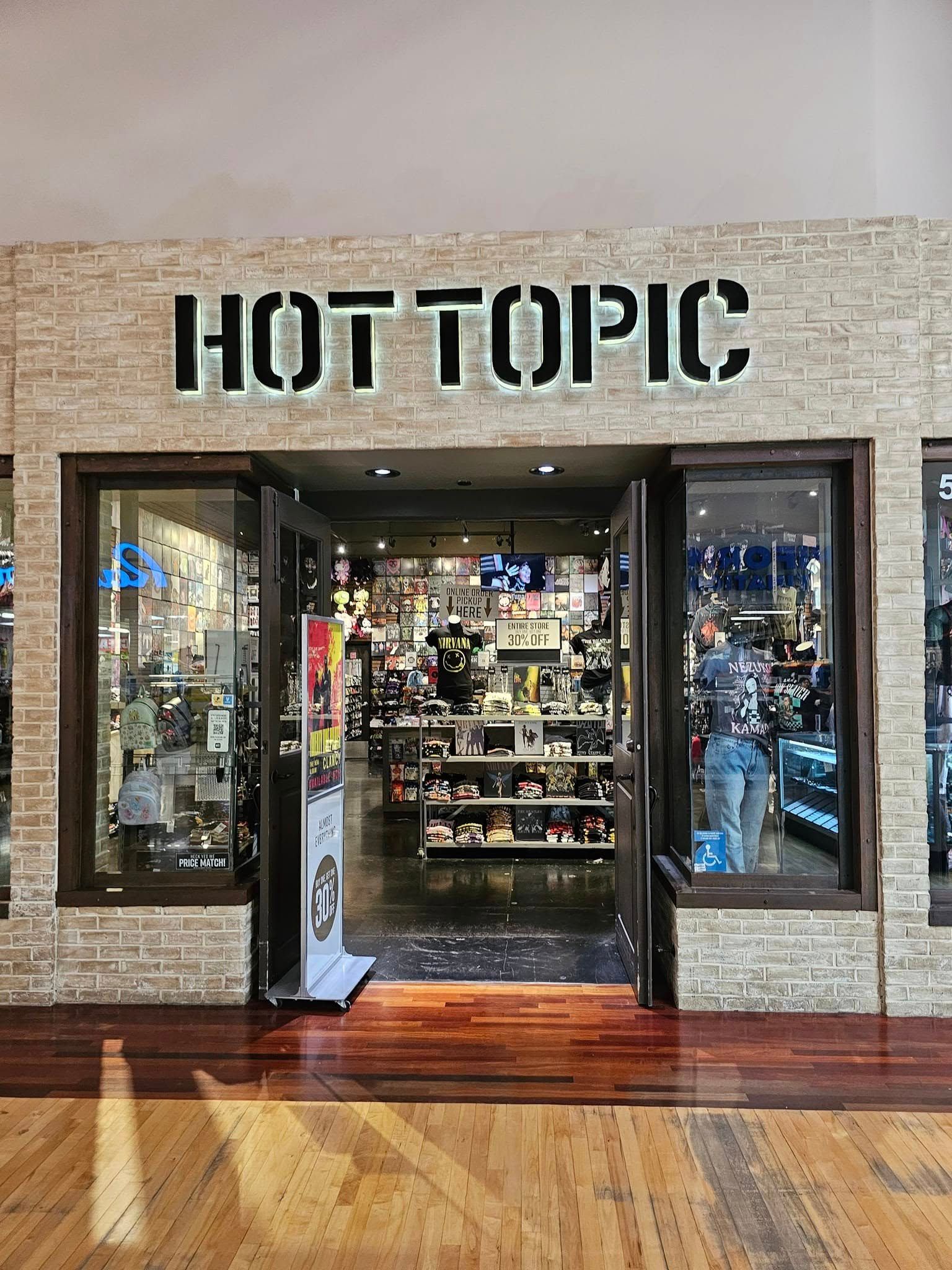 The front of a hot topic store in a mall.
