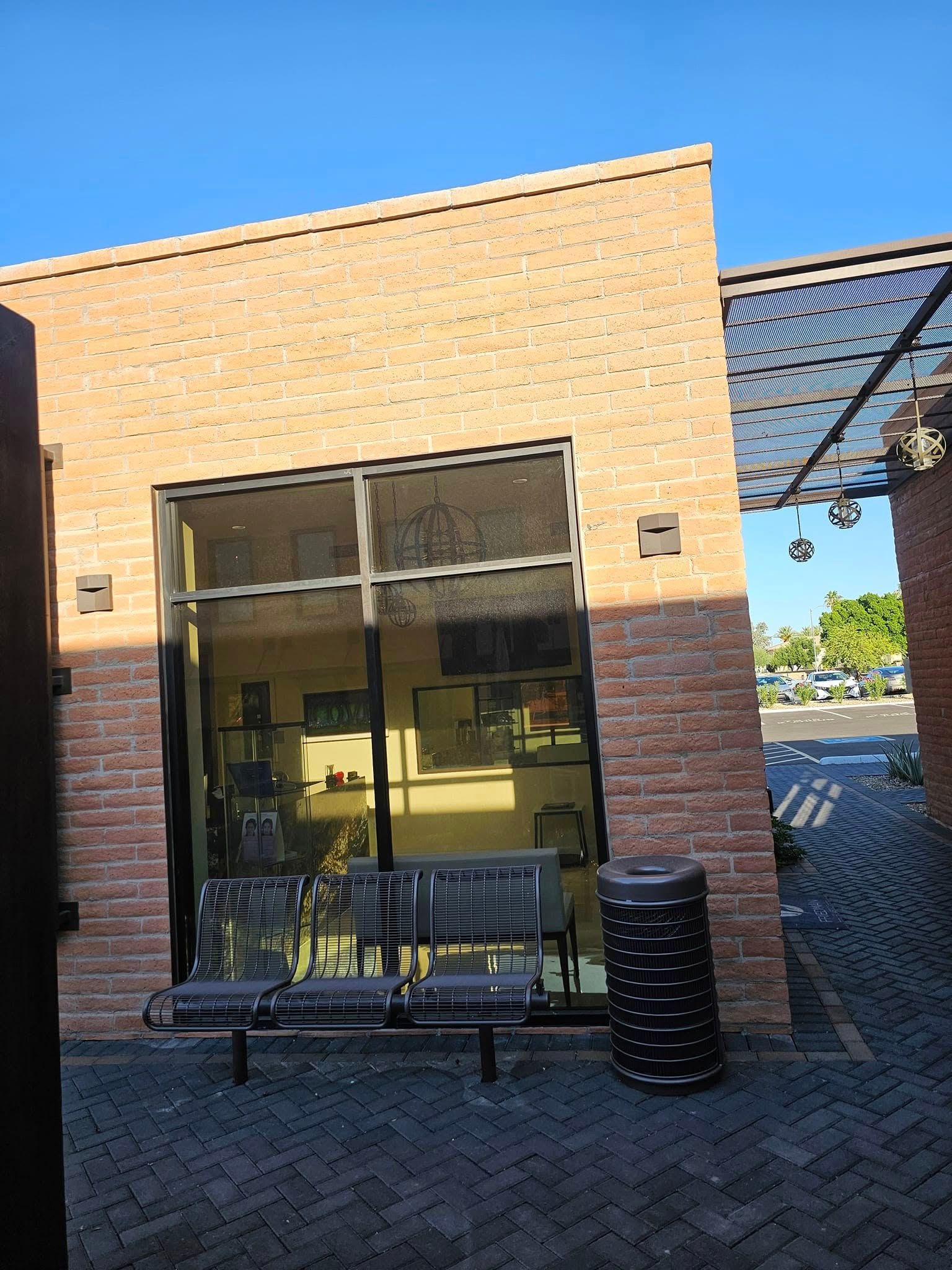 A brick building with a bench in front of it